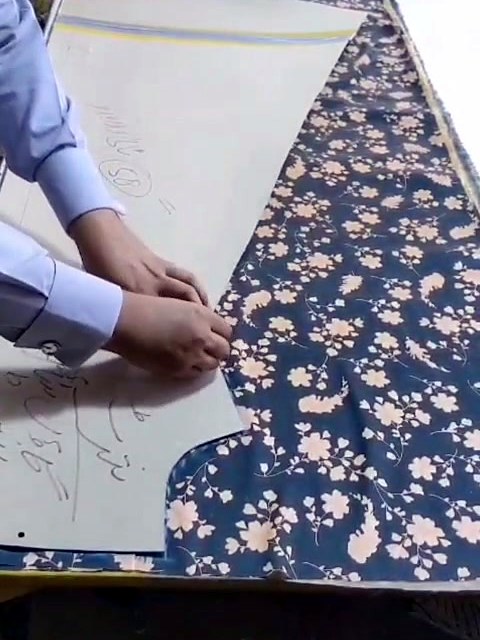 Cutting a printed shirt panel before stitching
